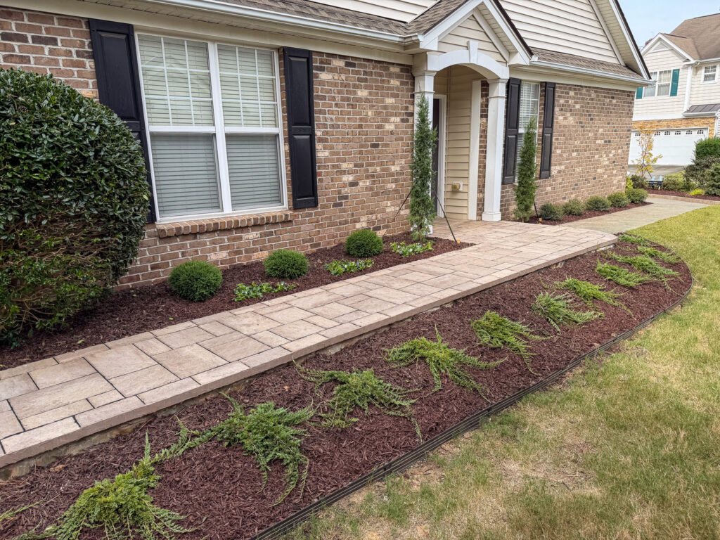 Stone pathway edging by Holly Springs NC landscaping company